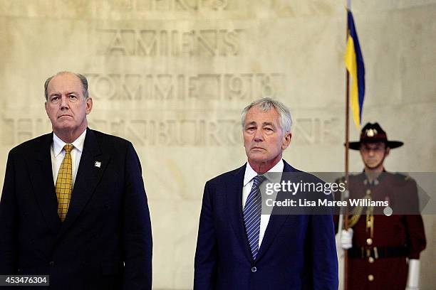 Australian Defence Minister David Johnston and US Secretary of Defence Chuck Hagel pause for a moments silence during a wreath laying ceremony on...