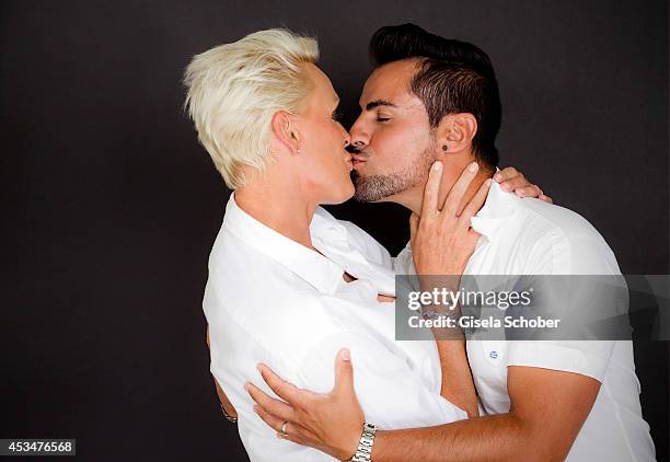 Brigitte Nielsen and husband Mattia Dessi pose during a Portrait Session on July 6, 2014 in Milano,Italy.