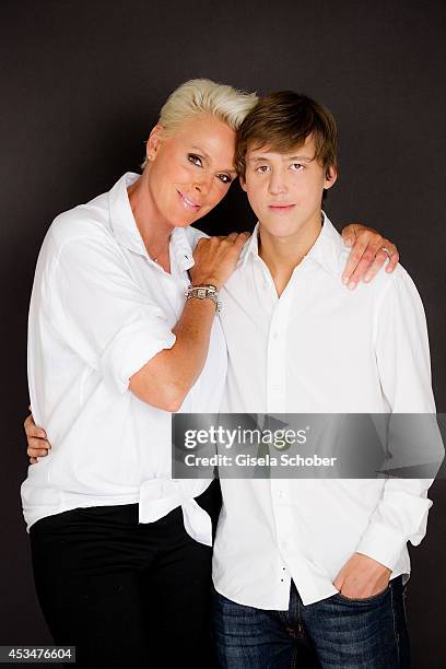 Brigitte Nielsen and her son Raoul Ayrton Meyer Jr. Pose during a portrait session on July 6, 2014 in Milan, Italy.