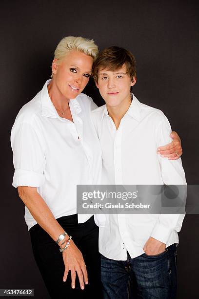 Brigitte Nielsen and her son Raoul Ayrton Meyer Jr. Pose during a portrait session on July 6, 2014 in Milan, Italy.