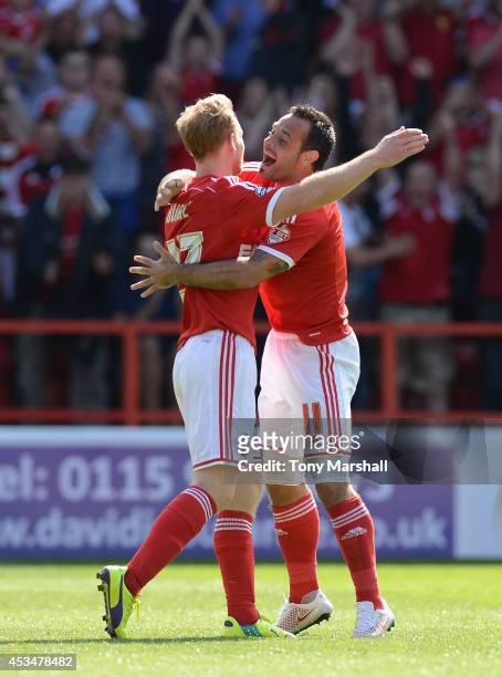 Chris Burke of Nottingham Forest celebrates scoring their second goal with Andy Reid during the Sky Bet Championship match between Nottingham Forest...