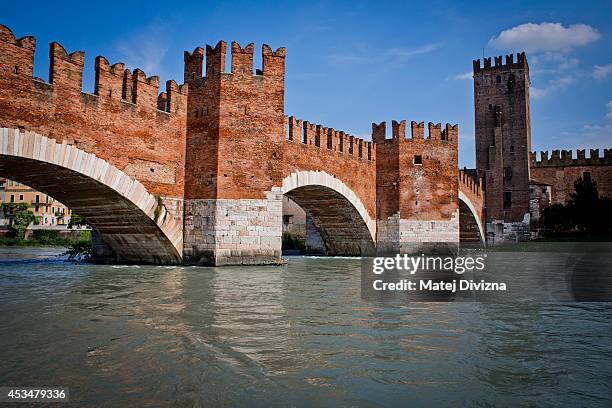 The Castelvecchio Bridge or Scaliger Bridge , over Adige river and completed in 1356, is pictured on July 25, 2014 in Verona, Italy.