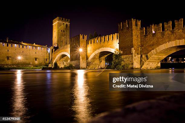 The Castelvecchio Bridge or Scaliger Bridge , over Adige river and completed in 1356, is pictured on July 25, 2014 in Verona, Italy.