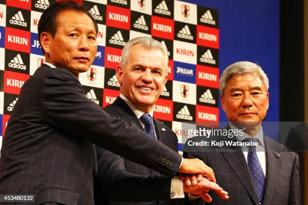 New Manager for Japan National Soccer Team Javier Aguirre shakes hands with Japan Football Association president Kuniya Daini and JFA executive...