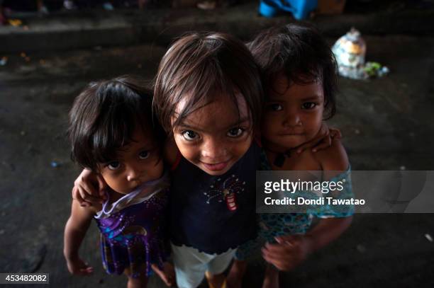 Children beg for alms in a street on August 11, 2014 in Manila, Philippines. The Philippines has one of the fastest growing populations in Southeast...