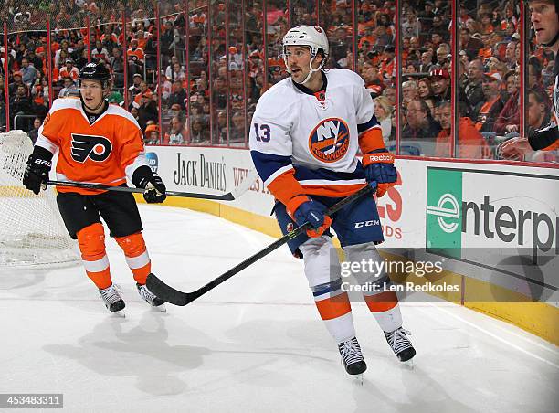 Colin McDonald of the New York Islanders skates against Erik Gustafsson of the Philadelphia Flyers on November 23, 2013 at the Wells Fargo Center in...