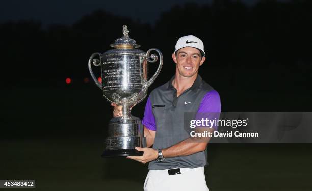 Rory McIlroy of Northern Ireland poses with the Wanamaker trophy after his one-stroke victory during the final round of the 96th PGA Championship at...