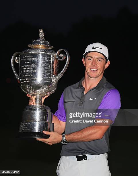 Rory McIlroy of Northern Ireland poses with the Wanamaker Trophy after his one-stroke victory during the final round of the 96th PGA Championship at...