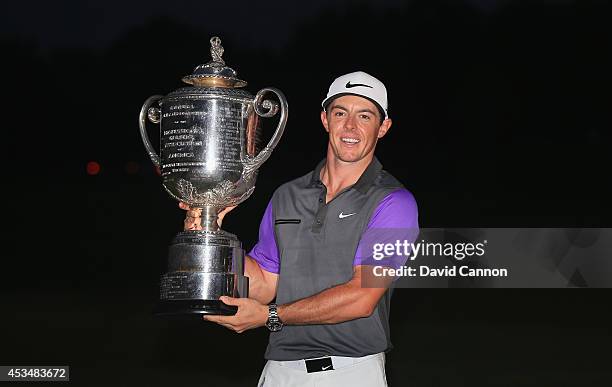 Rory McIlroy of Northern Ireland poses with the Wanamaker Trophy after his one-stroke victory during the final round of the 96th PGA Championship at...