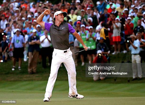 Rory McIlroy of Northern Ireland celebrates his one-stroke victory on the 18th green during the final round of the 96th PGA Championship at Valhalla...