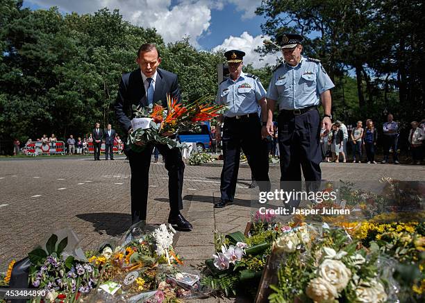 Australian PM Tony Abbott lays a lays a wreath in remembrance of the victims of Malaysia Airlines flight MH17 on August 11, 2014 in Hilversum,...