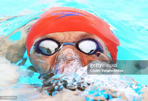 Robert Dinka of Slovakia competes in the Men's 400m Individual Medley at Parc Jean-Drapeau during the 15th FINA World Masters Championships on August...