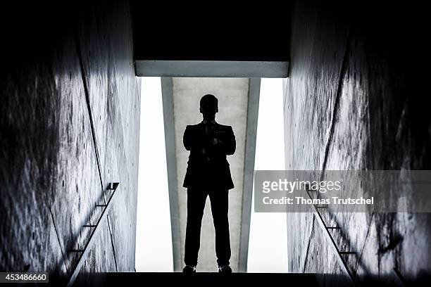 Man in a business suit at the end of a staircase on August 07, 2014 in Berlin, Germany.