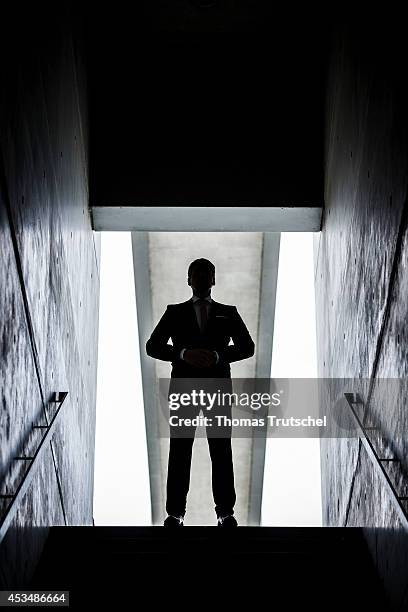 Man in a business suit at the end of a staircase on August 07, 2014 in Berlin, Germany.