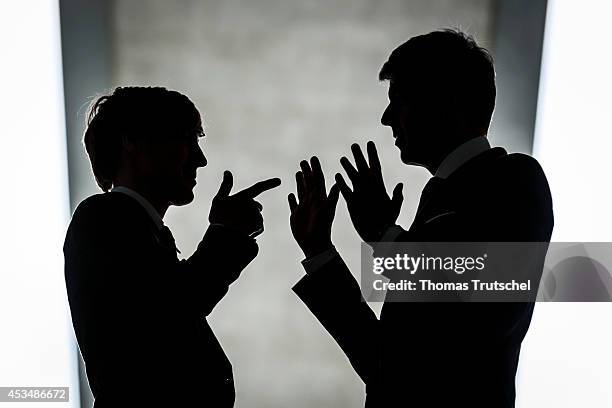 Two Men wearing business business suits have an argument on August 07, 2014 in Berlin, Germany.