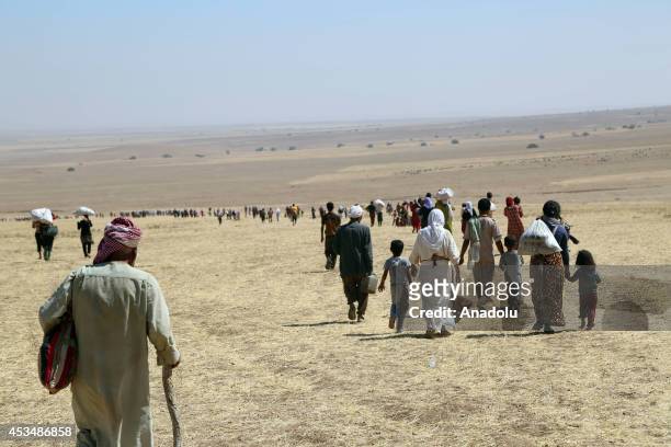 Thousands of Yezidis trapped in the Sinjar mountains without food and water for days as they tried to escape from Islamic State forces, are rescued...