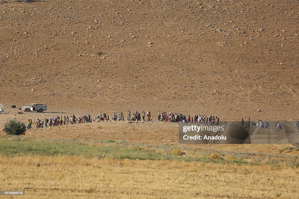 Yezidis trapped in the Sinjar mountains are rescued