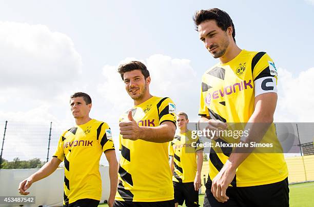 Jonas Hofmann, Milos Jojic and Mats Hummels on their way to the Borussia Dortmund team presentation on August 11, 2014 in Dortmund, Germany.