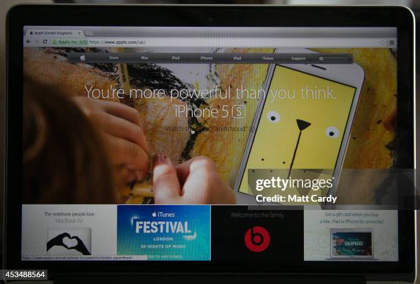 In this photo illustration a laptop displays the Apple website on August 11, 2014 in Bristol, United Kingdom. This week marks the 20th anniversary of...