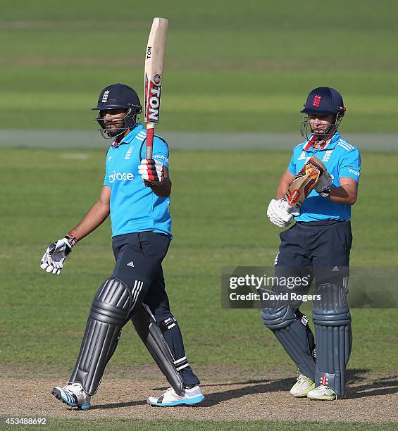 Ravi Bopara of the England Lions celebrates with team mate James Taylor after Bopara scores a century during the Triangular Series match between...