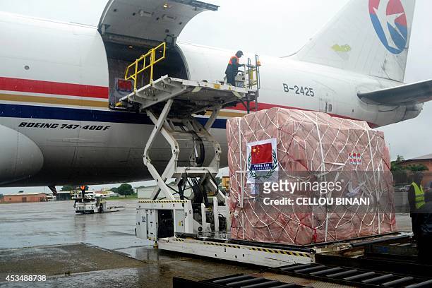 Workers unload medical supplies, coming from China and worth 4.9 million USD , for countries hit by the Ebola outbreak from an airplane at the...