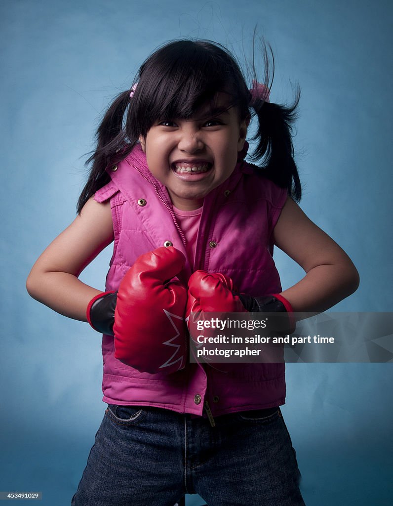Boxing girl with angry face