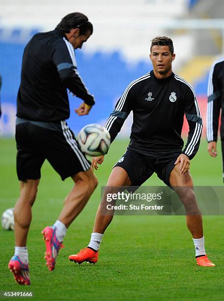 Real Madrid player Gareth Bale and Ronaldo in action during Real Madrid training prior to the UEFA Super Cup match at Cardiff City Stadium on August...