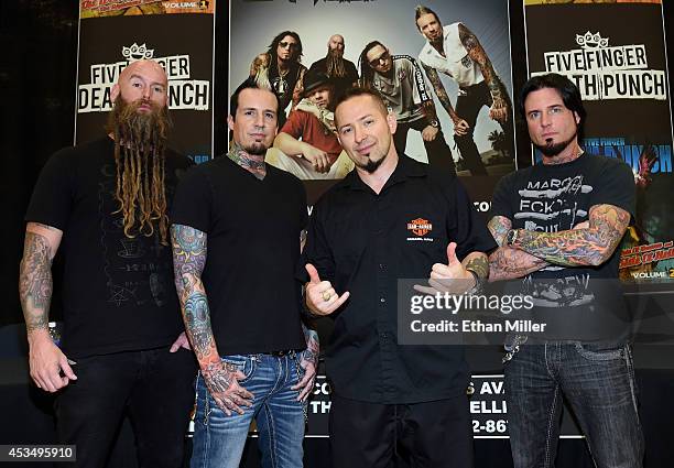 Bassist Chris Kael, drummer Jeremy Spencer, and guitarists Zoltan Bathory and Jason Hook of Five Finger Death Punch appear at Nellis Air Force Base...