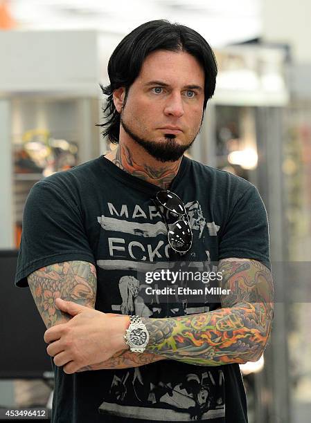 Guitarist Jason Hook of Five Finger Death Punch watches the group's new video being shown at Nellis Air Force Base as the band highlights its...