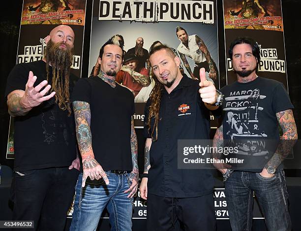 Bassist Chris Kael, drummer Jeremy Spencer, and guitarists Zoltan Bathory and Jason Hook of Five Finger Death Punch appear at Nellis Air Force Base...