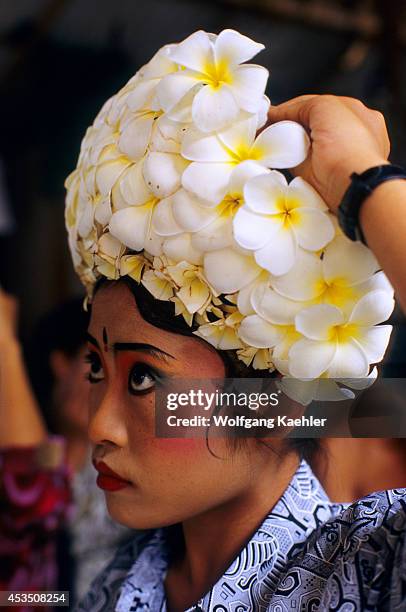 Indonesia, Bali, Barong Dance, Dancer Preparing Costume, Frangipani Flowers.