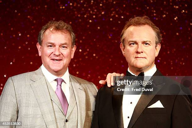 Hugh Bonneville Actor Hugh Bonneville attends a photocall to unveil his new Wax Figure at Madame Tussauds on August 12, 2014 in London, England.