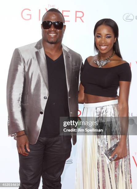 And DJ Kiss attend "The Giver" premiere at Ziegfeld Theater on August 11, 2014 in New York City.