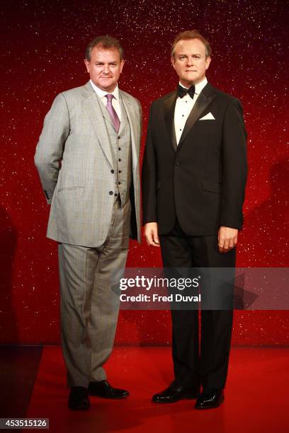 Actor Hugh Bonneville attends a photocall to unveil his new Wax Figure at Madame Tussauds on August 12, 2014 in London, England.