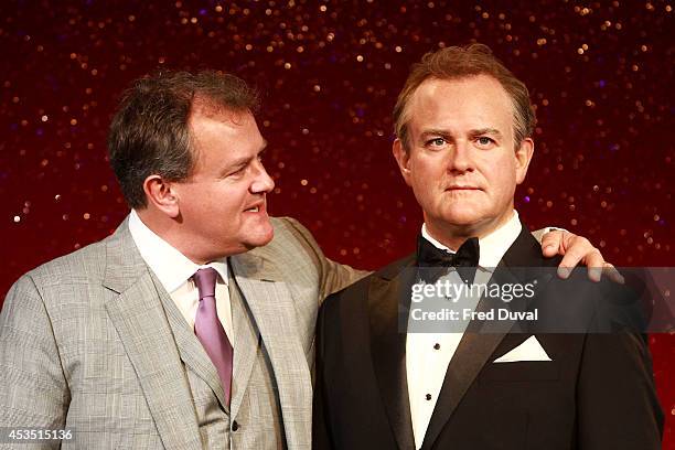 Actor Hugh Bonneville attends a photocall to unveil his new Wax Figure at Madame Tussauds on August 12, 2014 in London, England.