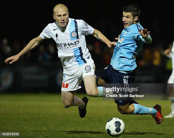 Terry Antonis of Sydney FC and Aaron Mooy of City compete for the ball during the FFA Cup match between Melbourne City and Sydney FC at Morshead Park...