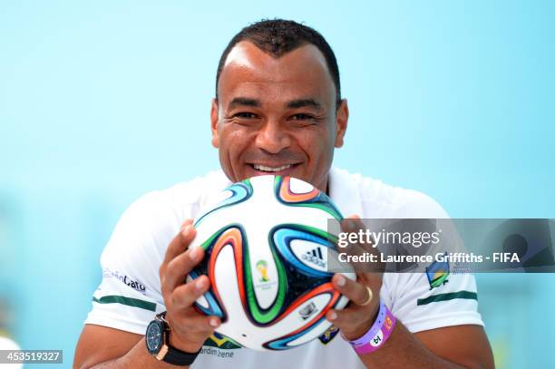 Former Brazil footballer Cafu poses with the adidas Brazuca, official match ball for the 2014 FIFA World Cup Brazil during previews ahead of the...