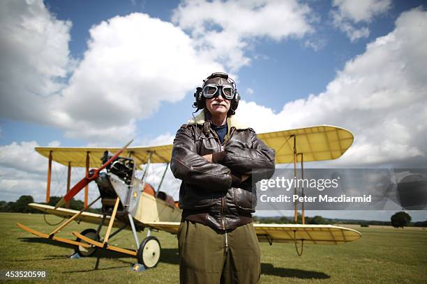 Navigator Stephen Slater stands with a replica BE-2 biplane of the Royal Flying Corp comes into land on August 12, 2014 in Headcorn, England. To...