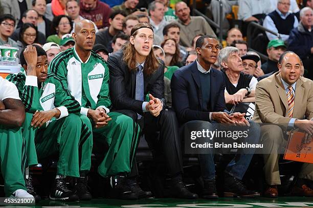 Keith Bogans, Kelly Olynyk and Rajon Rondo of the Boston Celtics look on during the game against the Milwaukee Bucks on December 3, 2013 at the TD...