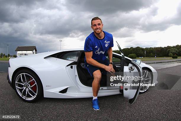 Ralf Faehrmann of Schalke gets out of a Lamborghini during a test drive at driving safety centre Rheinberg on August 12, 2014 in Rheinberg, Germany.