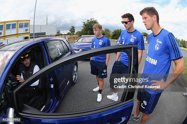 Max Meyer, Leon Goretzka and Klaas-Jan Huntelaar get instructions from a test drive during a test drive of Schalke at driving safety centre Rheinberg...