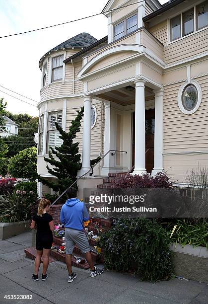 Well wishers gather in front of the home where actor and comedian Robin Williams filmed the movie Mrs. Doubtfire on August 12, 2014 in San Francisco,...