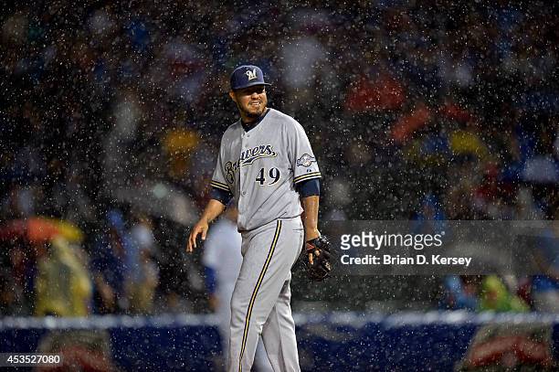 Staring pitcher Yovani Gallardo of the Milwaukee Brewers stands on the mound during the fourth inning against the Chicago Cubs at Wrigley Field on...