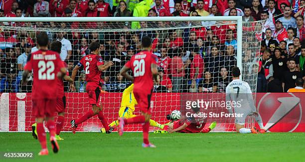 Real Madrid player Ronaldo scores the opening goal during the UEFA Super Cup match between Real Madrid and Sevilla FC at Cardiff City Stadium on...
