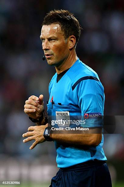 Referee Mark Clattenburg in action during the UEFA Super Cup between Real Madrid and Sevilla FC at Cardiff City Stadium on August 12, 2014 in...