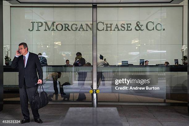 Man stands outside JP Morgan Chase's corporate headquarters on August 12, 2014 in New York City. U.S. Banks announced second quarter profits of more...