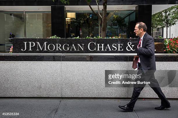 Man walks past JP Morgan Chase's corporate headquarters on August 12, 2014 in New York City. U.S. Banks announced second quarter profits of more than...