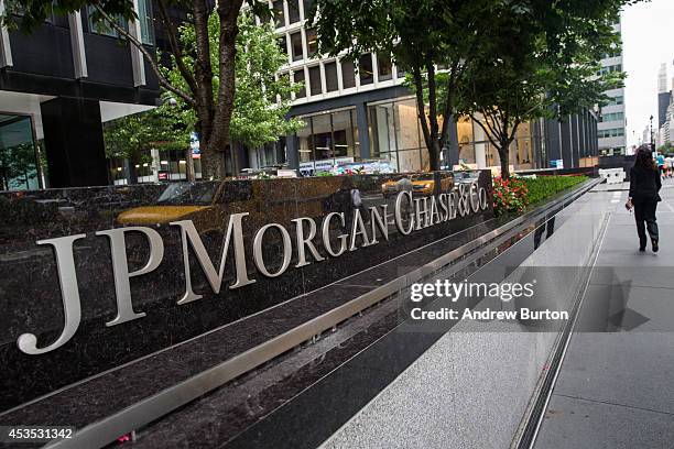 Woman walks past JP Morgan Chase's corporate headquarters on August 12, 2014 in New York City. U.S. Banks announced second quarter profits of more...