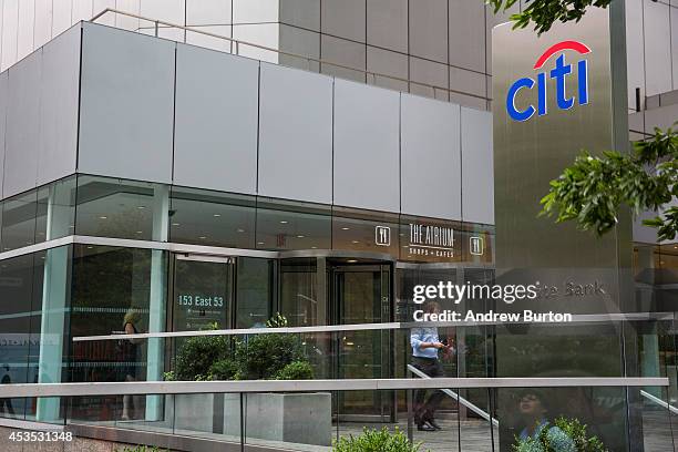 Man walks out of Citi Bank's corporate headquarters on August 12, 2014 in New York City. U.S. Banks announced second quarter profits of more than $40...