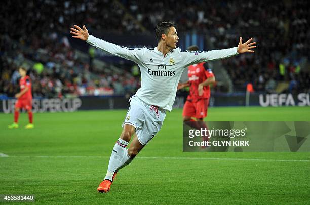 Real Madrid's Portuguese striker Cristiano Ronaldo celebrates scoring his second goal during the UEFA Super Cup football match between Real Madrid...